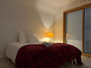 Katil atau katil-katil dalam bilik di Le GRANNEC