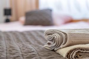 Łóżko lub łóżka w pokoju w obiekcie Apartament Claro