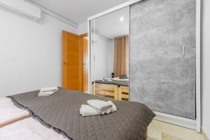 Łóżko lub łóżka w pokoju w obiekcie Apartament Claro