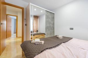 Łóżko lub łóżka w pokoju w obiekcie Apartament Claro
