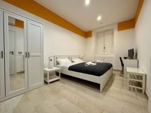Rúm í herbergi á B&B Una notte a Mazzini