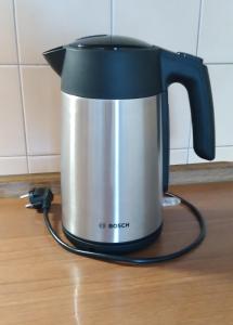 a black and silver tea kettle sitting on a counter at Apartmány Šrámek Stříbro in Stříbro