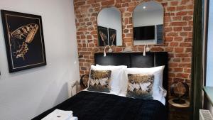 Łóżko lub łóżka w pokoju w obiekcie Apartamenty KB Toruń