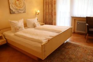Postel nebo postele na pokoji v ubytování Haus Hubertus