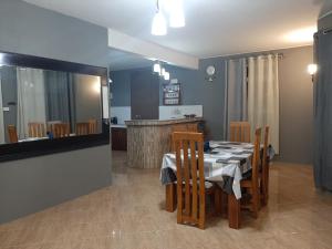 a dining room with a table and some chairs at Villa Jehan Tourist Residence in Souillac