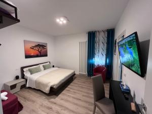 TV a/nebo společenská místnost v ubytování verona rooms 109