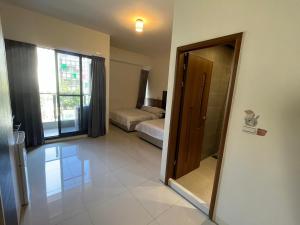 Кровать или кровати в номере Hermes B&B