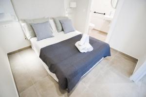 Posteľ alebo postele v izbe v ubytovaní Letmalaga Granada Premium