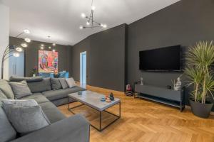 Televízia a/alebo spoločenská miestnosť v ubytovaní The HostMaster Artistic Inn