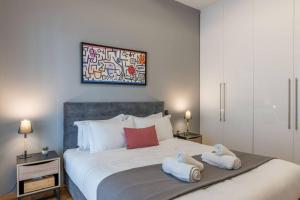 Posteľ alebo postele v izbe v ubytovaní The HostMaster Artistic Inn