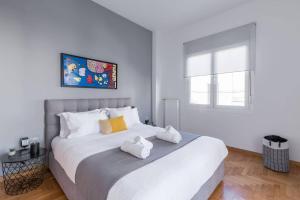 Posteľ alebo postele v izbe v ubytovaní The HostMaster Artistic Inn