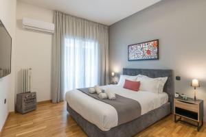 Posteľ alebo postele v izbe v ubytovaní The HostMaster Artistic Inn