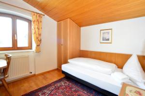 Postel nebo postele na pokoji v ubytování Appartements Kirchmair