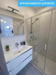 a bathroom with a sink and a shower at MansardaTO - La Tua casa nel cuore di Torino in Turin