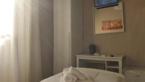 A bed or beds in a room at Albergo la Svolta