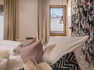 Postel nebo postele na pokoji v ubytování Gästehaus Oblasser