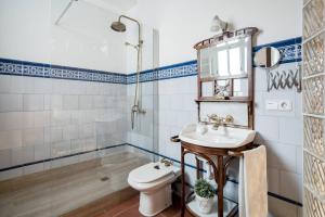 a bathroom with a sink and a toilet and a shower at Lovely loft near Barcelona center in Barcelona