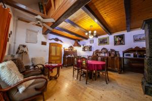 a living room with a table and chairs at Sziget Vendégház in Kőszeg