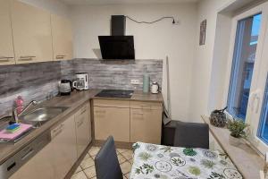 a kitchen with a sink and a counter top at Ferien-/Monteurwohnung im Odw. in Mörlenbach