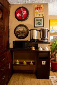 a kitchen with a stove and some signs on the wall at Hotel Cisne in Cuenca