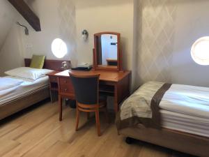 Posteľ alebo postele v izbe v ubytovaní Gizella Hotel and Restaurant