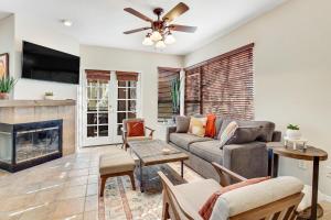 a living room with a couch and a fireplace at Canyon Crest Condo in Tucson