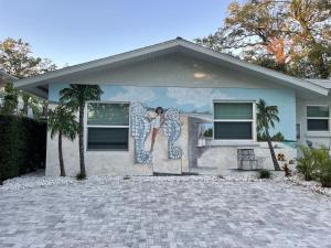 a house with a mural on the side of it at El Tropicale in Sarasota