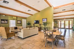 a living room with a couch and a table at Beautiful Naples Golf Villa in Famous Lely Resort! in Naples