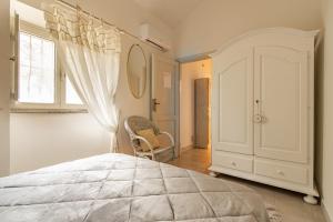 A bed or beds in a room at Casa Lilliosa