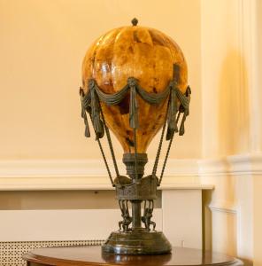 a vase sitting on top of a table at Grant Arms Hotel in Grantown on Spey