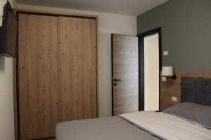 A bed or beds in a room at DolceAmbiez Apartments