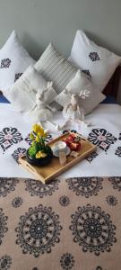 a tray of food on top of a bed at Villa Veronika in Lądek-Zdrój