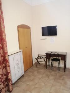 TV a/nebo společenská místnost v ubytování Hotel de Rossi