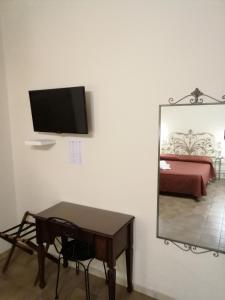 TV a/nebo společenská místnost v ubytování Hotel de Rossi