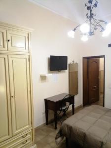 Postel nebo postele na pokoji v ubytování Hotel de Rossi