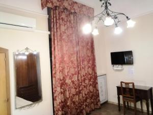 TV a/nebo společenská místnost v ubytování Hotel de Rossi
