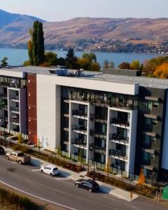 an aerial view of an apartment building with a highway at Vita Resort on Lake Okanagan in Vernon