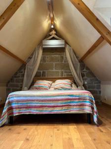 Postel nebo postele na pokoji v ubytování Le Pigeonnier de Lissac