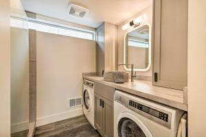 a laundry room with a washer and dryer at Beach Escape Scenic Osoyoos Lake Chalet! in Oroville