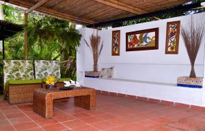 a patio with a table and a couch and a bench at Casa Catalonia 