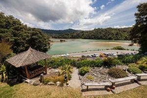 a view of a body of water with a beach at Luxury in Kaiteriteri in Kaiteriteri