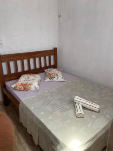 Tempat tidur dalam kamar di House Nativa