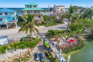an aerial view of a beach with boats in the water at Carpe Diem in Stuart