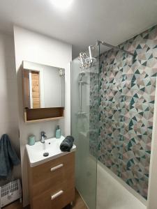 a bathroom with a shower and a sink and a mirror at Lovely apparment in fornt of the port of Gandia in Los Mártires