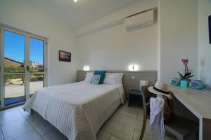 Ένα ή περισσότερα κρεβάτια σε δωμάτιο στο Hotel Damanse