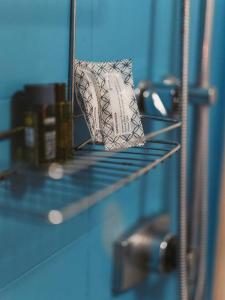 a small napkin sitting on a shelf in a room at LA DIMORA DEL PRINCIPE - Relaxing Private Terrace & City View in Polignano a Mare