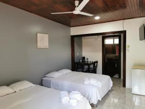 Postel nebo postele na pokoji v ubytování Hotel Puerto San Luis