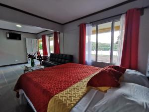 Postel nebo postele na pokoji v ubytování Hotel Puerto San Luis
