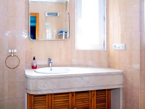 a bathroom with a sink and a mirror at Apartamento in Sierra Nevada