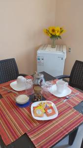 a table with plates of food on top of it at Armonia - La Victoria - Tarija in Tarija